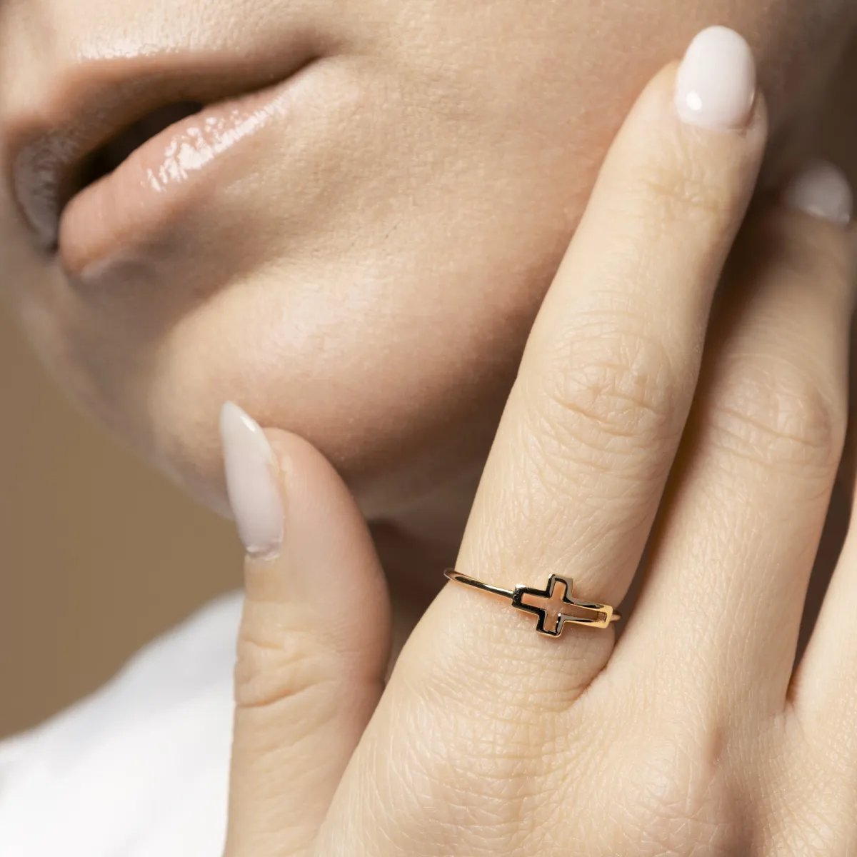 Yellow gold ring with cross sign