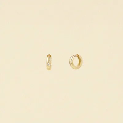 Yellow gold hoop earrings with zirconia