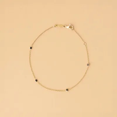 Yellow gold bracelet with black cubic zirconia