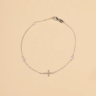 White gold bracelet with cross and cubic zirconia