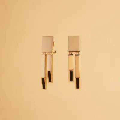 Yellow gold earrings with black enameled details from "Futura" collection