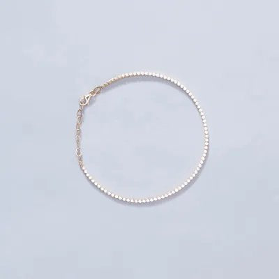 Yellow gold tennis bracelet with cubic zirconia