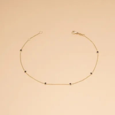 Yellow gold anklet with black cubic zirconia