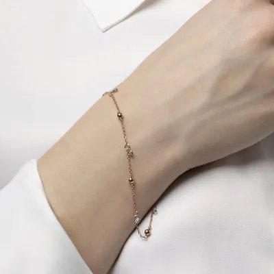 Rose gold bracelet with spheres and cubic zirconia