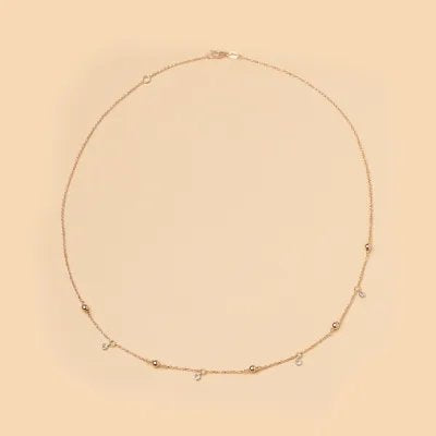 Rose gold necklace with spheres and cubic zirconia