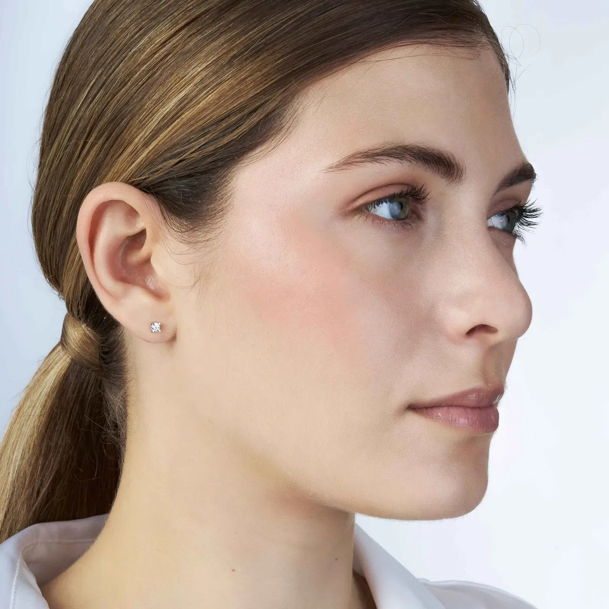 "Punto luce" earrings in white gold with zirconia