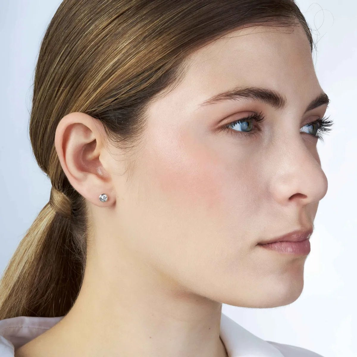 "Punto luce" earrings in white gold with zirconia