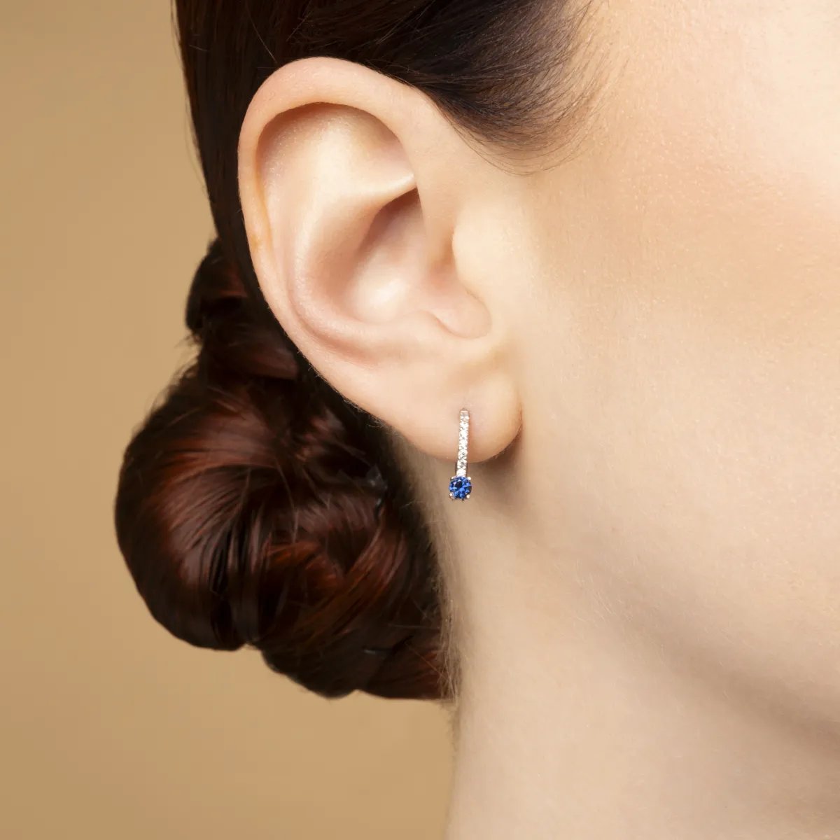 White gold monachella earrings with white and blue cubic zirconia