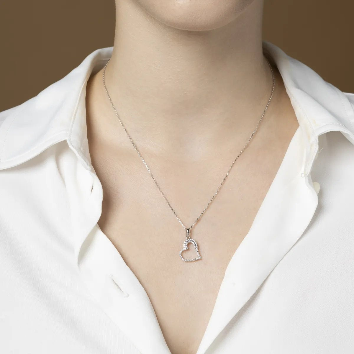 White gold heart-shaped pendant with cubic zirconia