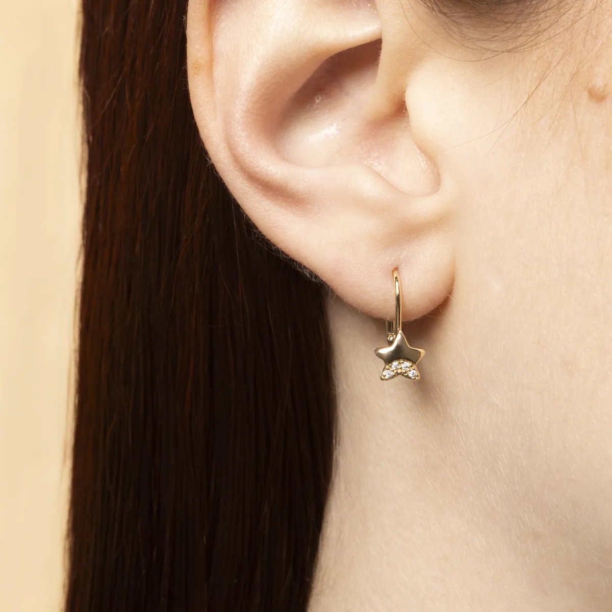 Yellow gold star earrings with cubic zirconia