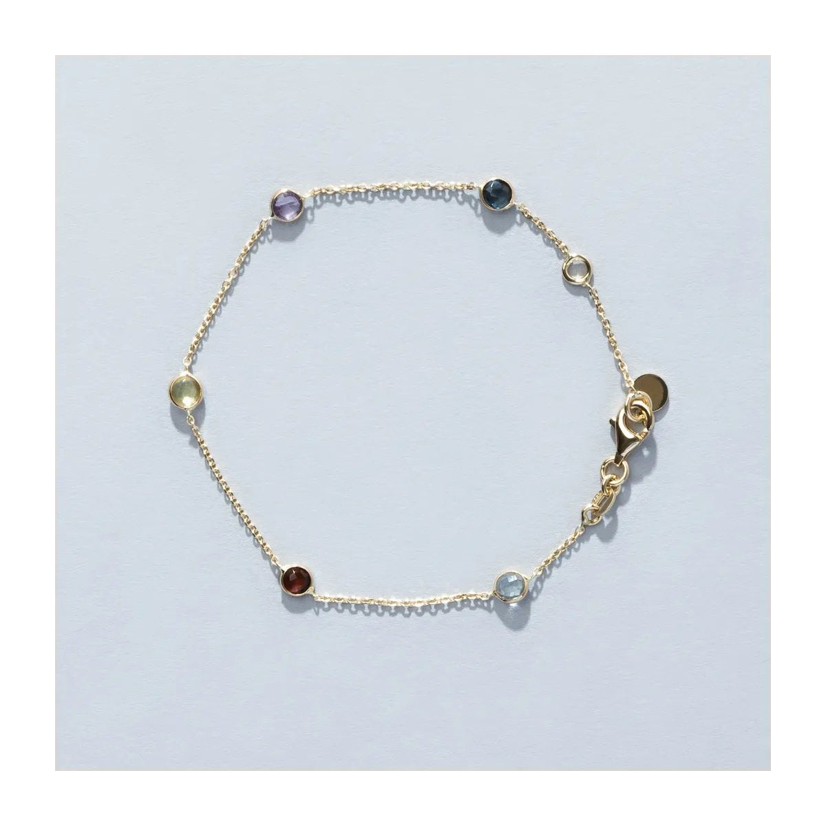 Yellow gold bracelet with natural stones