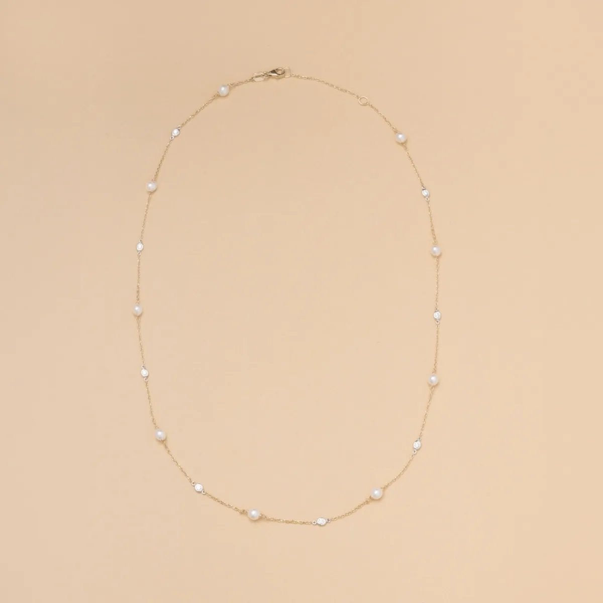 Bicolor necklace with pearls and cubic zirconia