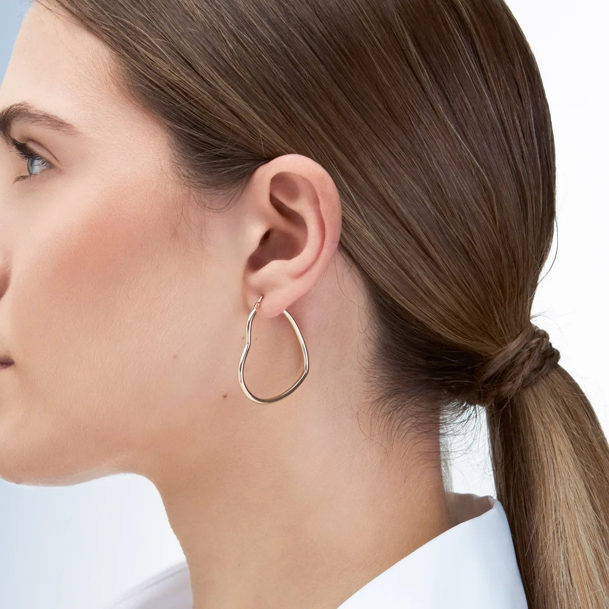 Yellow gold heart shaped tube earrings