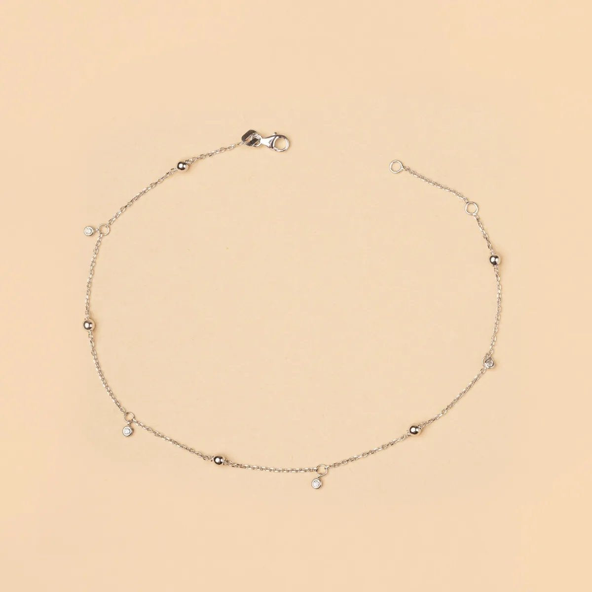 White gold anklet with spheres and cubic zirconia