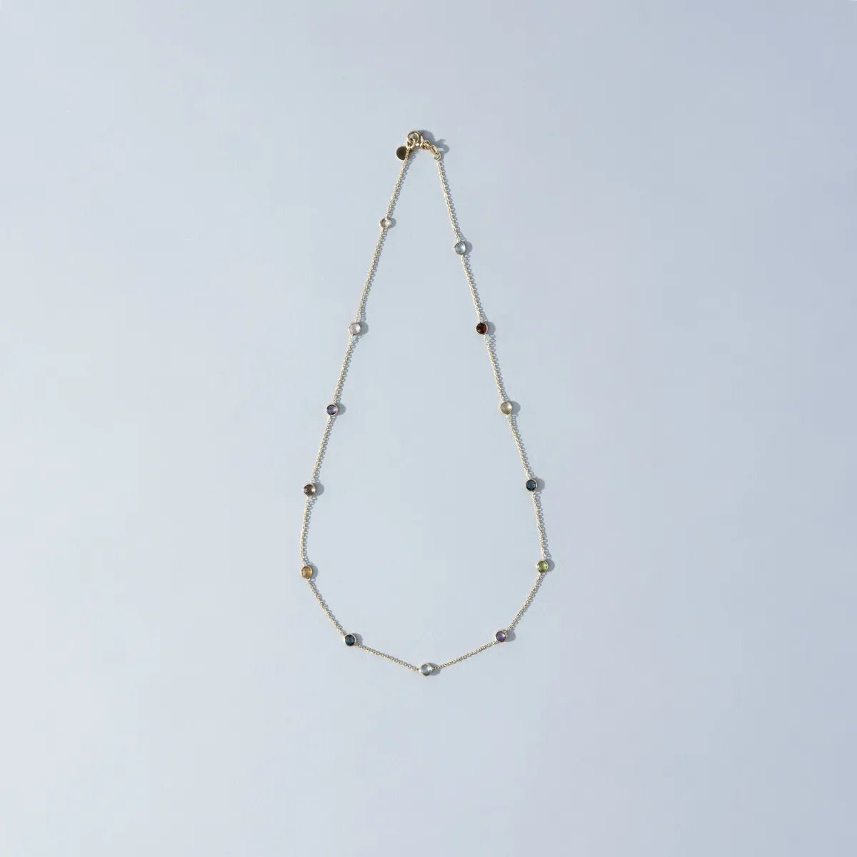 Yellow gold necklace with natural stones
