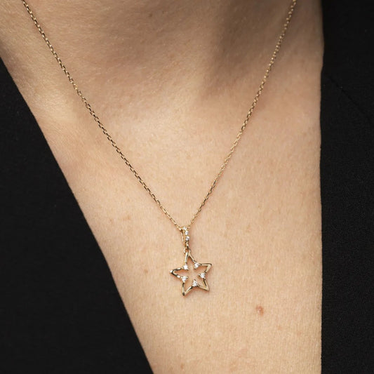 White and yellow gold moon-shaped pendant with cubic zirconia