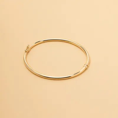 Yellow gold hollow bangle bracelet