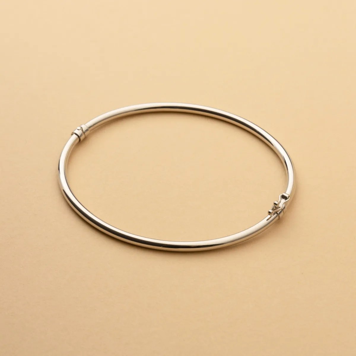 White gold round tube bangle