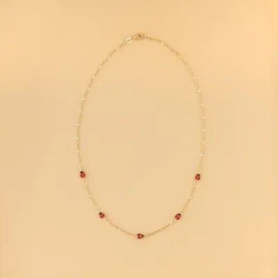 Yellow gold children's necklace with enameled ladybugs