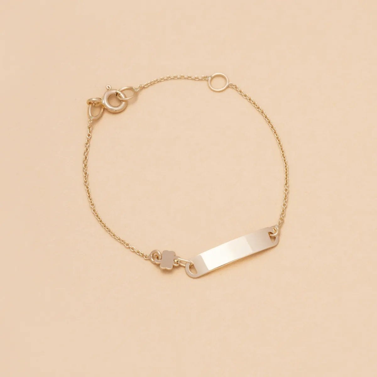 Yellow gold baby bracelet with four-leaf clover and plate
