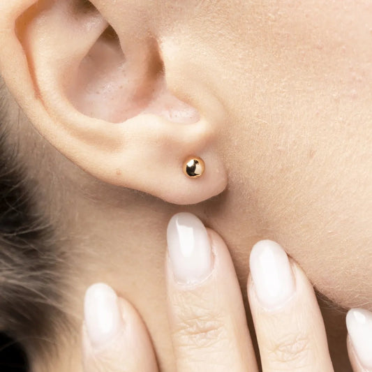 Yellow gold half ball earrings without stones