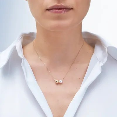 Yellow gold necklace with pearl and sliding ball