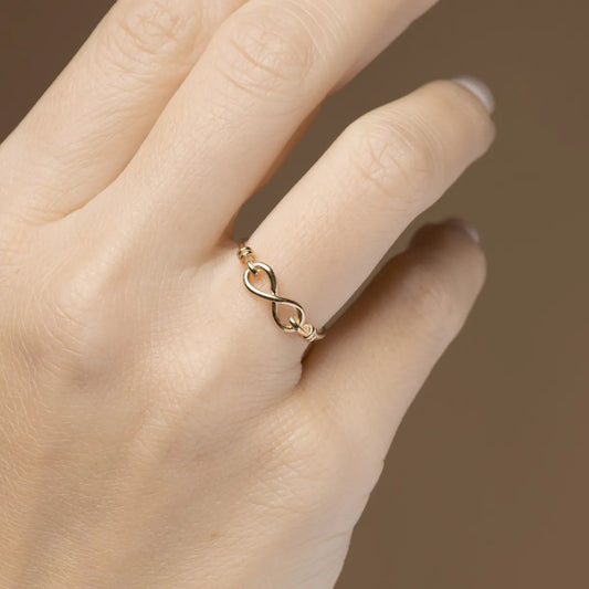 Yellow gold ring with infinity sign