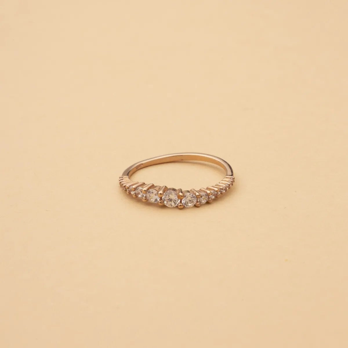 Red gold wavy ring with cubic zirconia