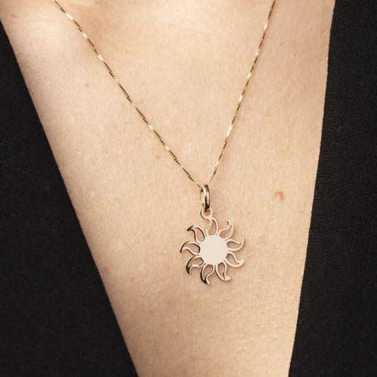 Yellow gold sun-shaped pendant