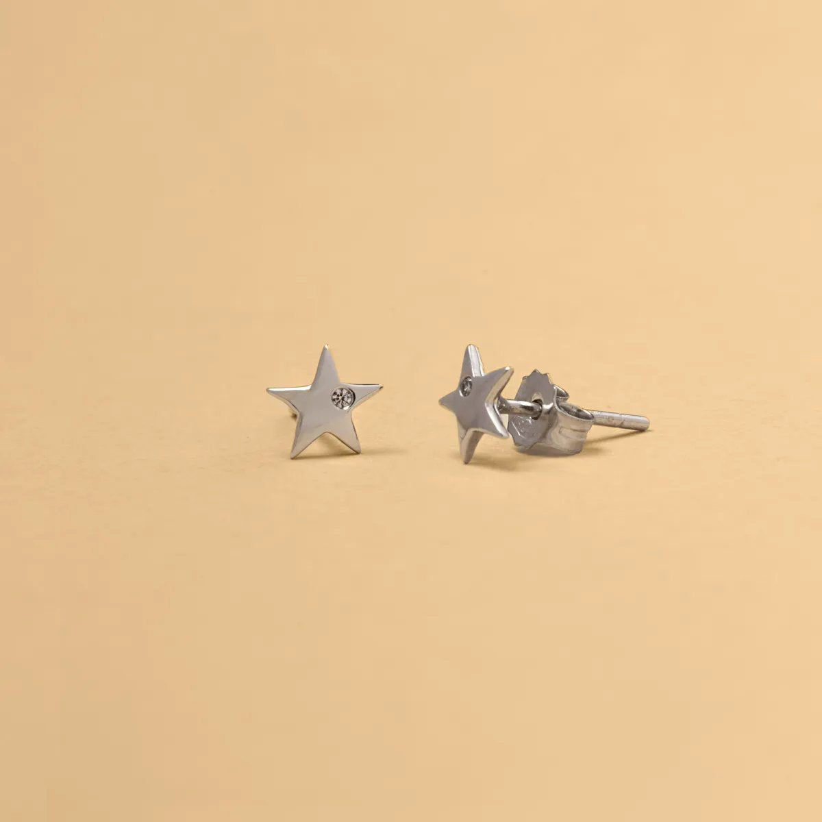 White gold star-shaped earrings with cubic zirconia