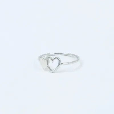 White gold ring with hollow and full shaped hearts