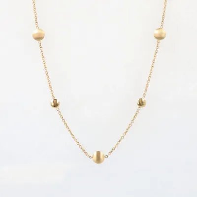 Yellow gold necklace with polished and satin-finished round elements