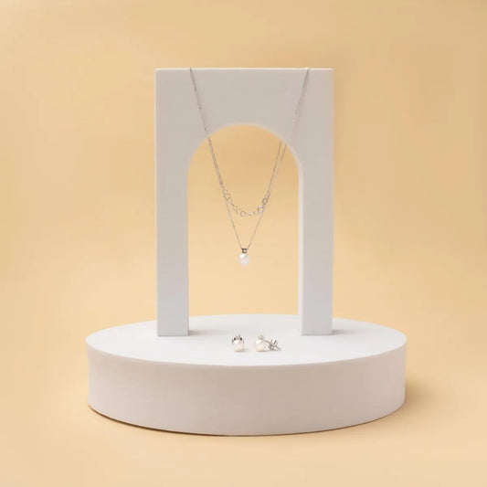 White gold set with pearls and cubic zirconia