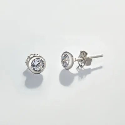 "Punto luce" earrings in white gold with zirconia