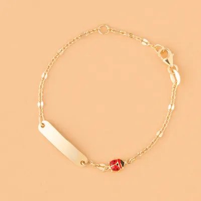 Yellow gold children's bracelet with enameled ladybugs