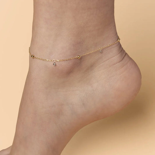 Yellow gold anklet with spheres and cubic zirconia