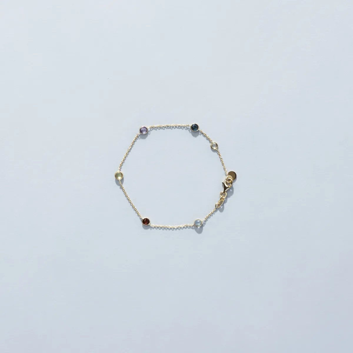 Yellow gold bracelet with natural stones