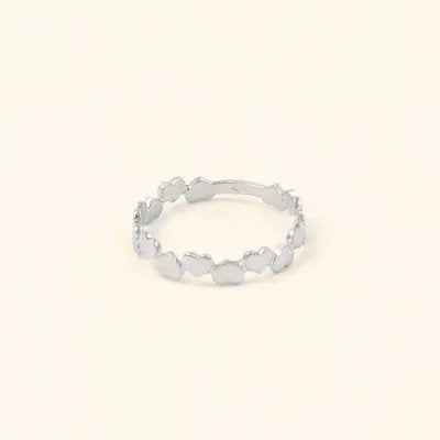 White gold ring with shaped hearts