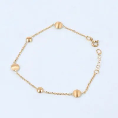 Yellow gold bracelet with polished and satin-finished round elements