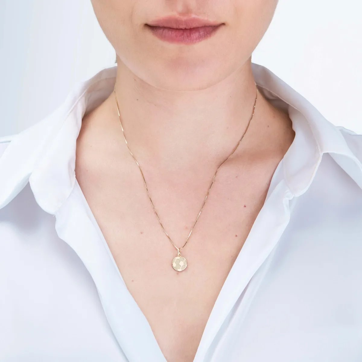 Yellow gold "soccer ball" pendant