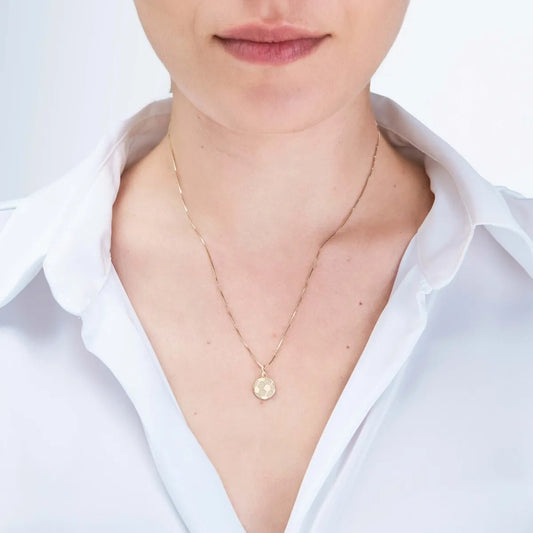 Yellow gold "soccer ball" pendant