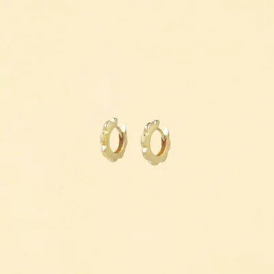 Yellow gold hoop earrings in the shape of a stylized flower