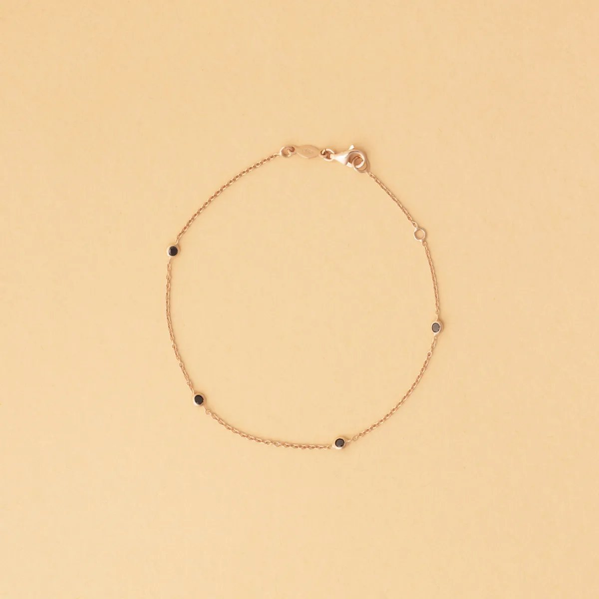 Rose gold bracelet with black cubic zirconia