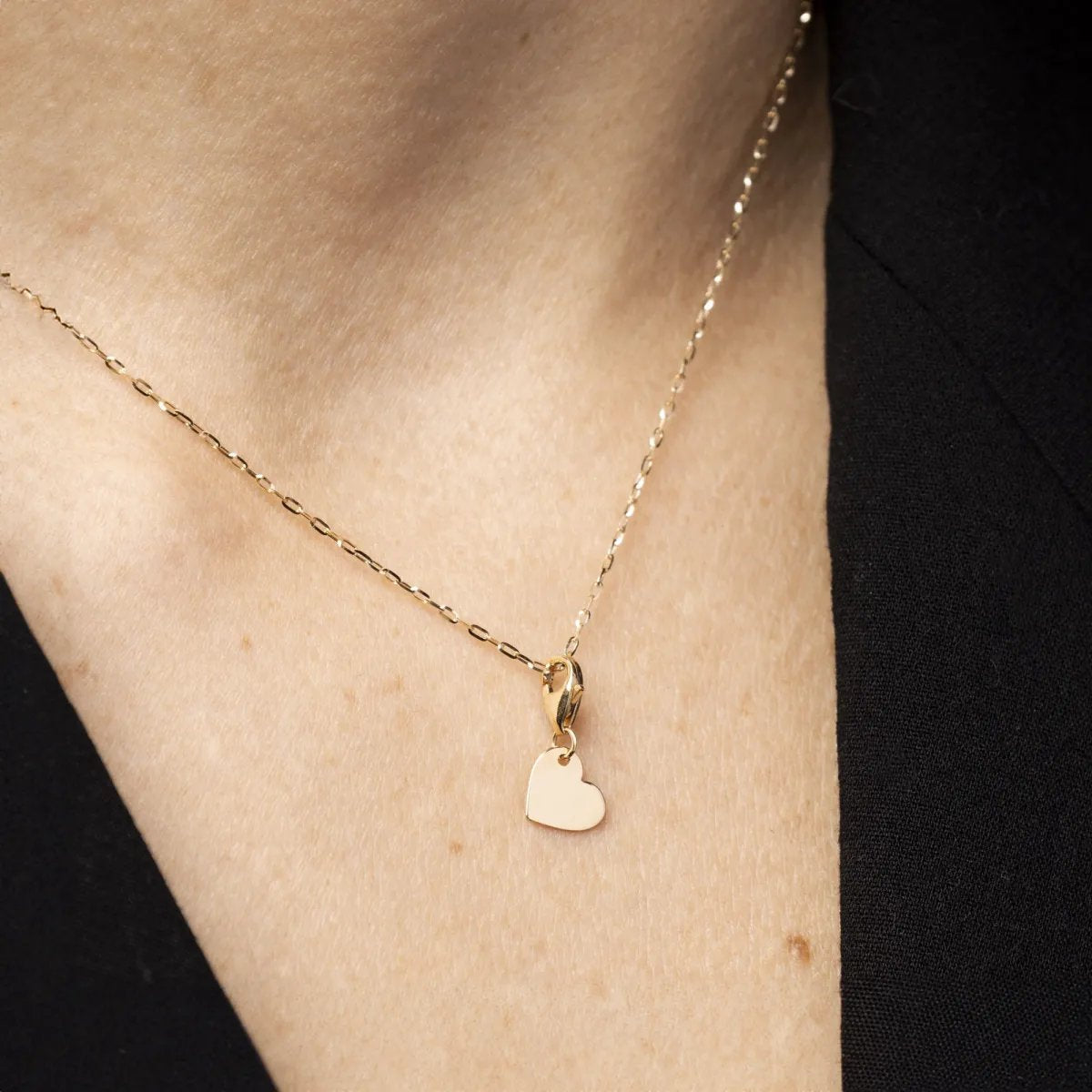 Yellow gold heart-shaped charm pendant