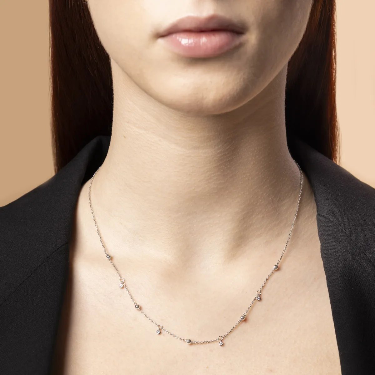 White gold necklace with spheres and cubic zirconia