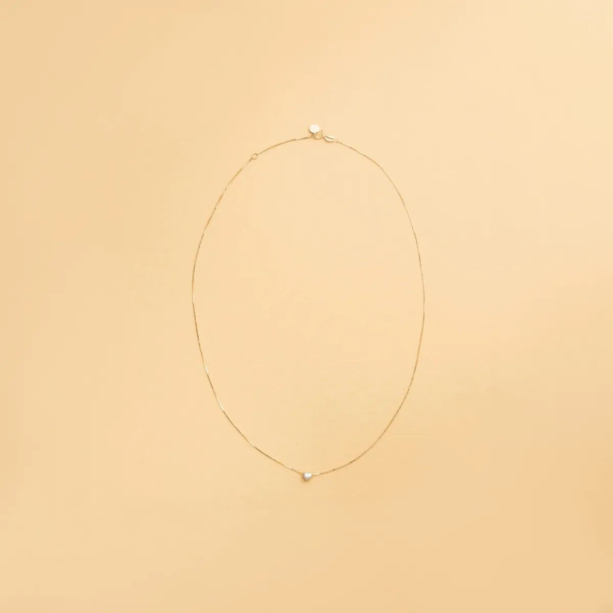 Yellow and white gold heart-shaped necklace