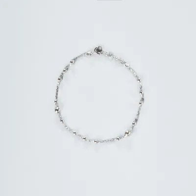 Light white gold bracelet with balls
