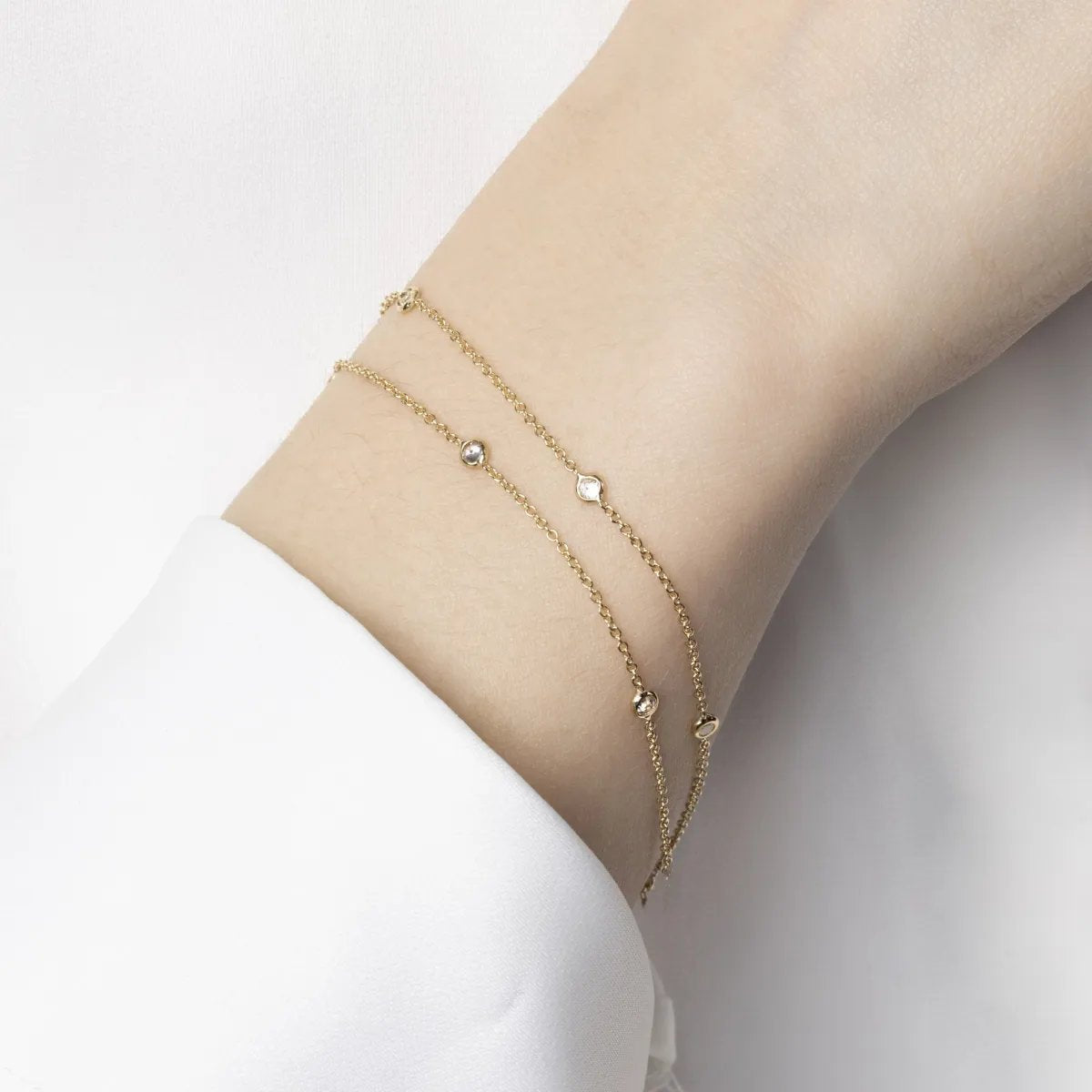 Yellow gold double bracelet with cubic zirconia