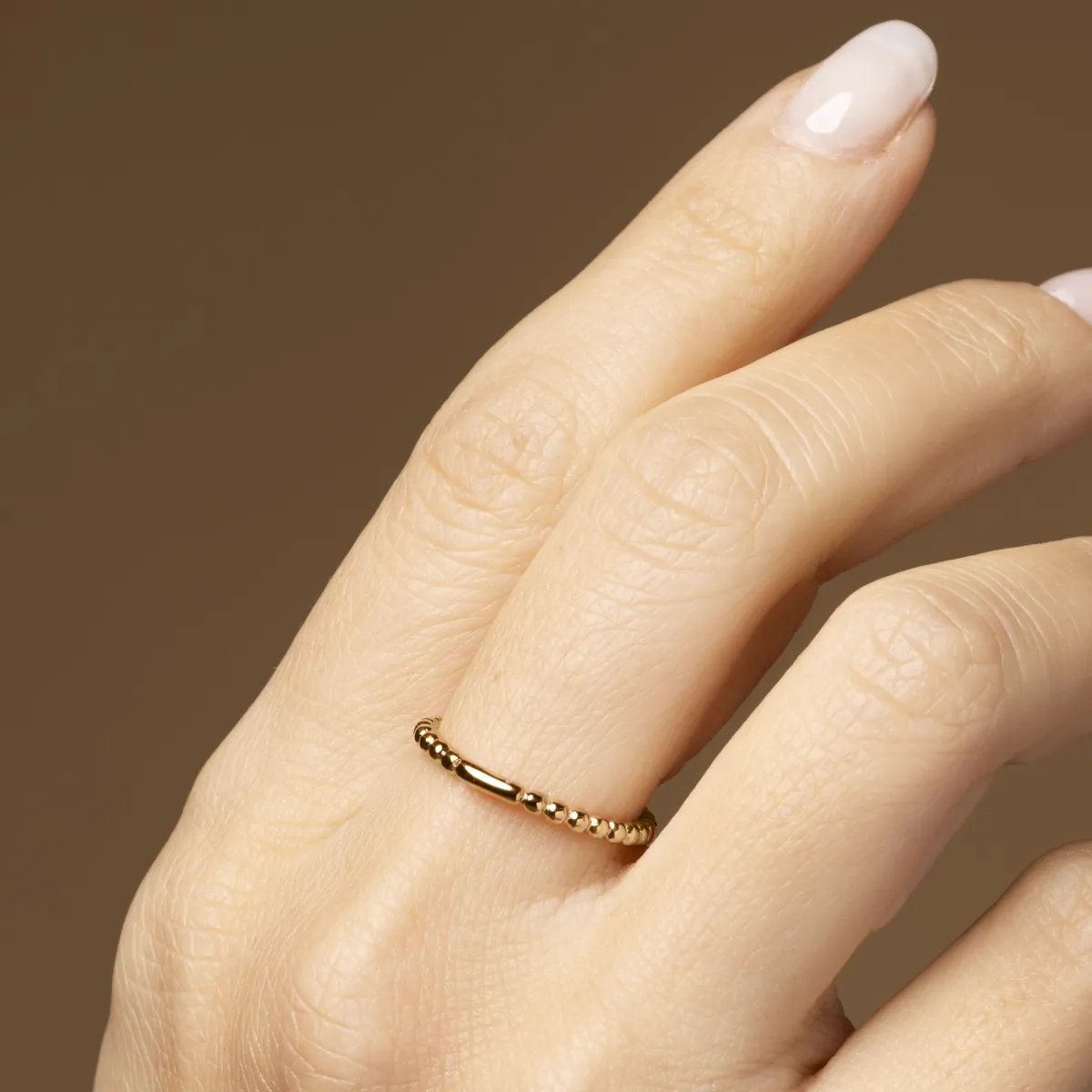 Yellow gold ring with balls