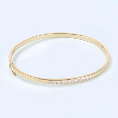 Yellow gold bangle with polish finish and row of zirconia